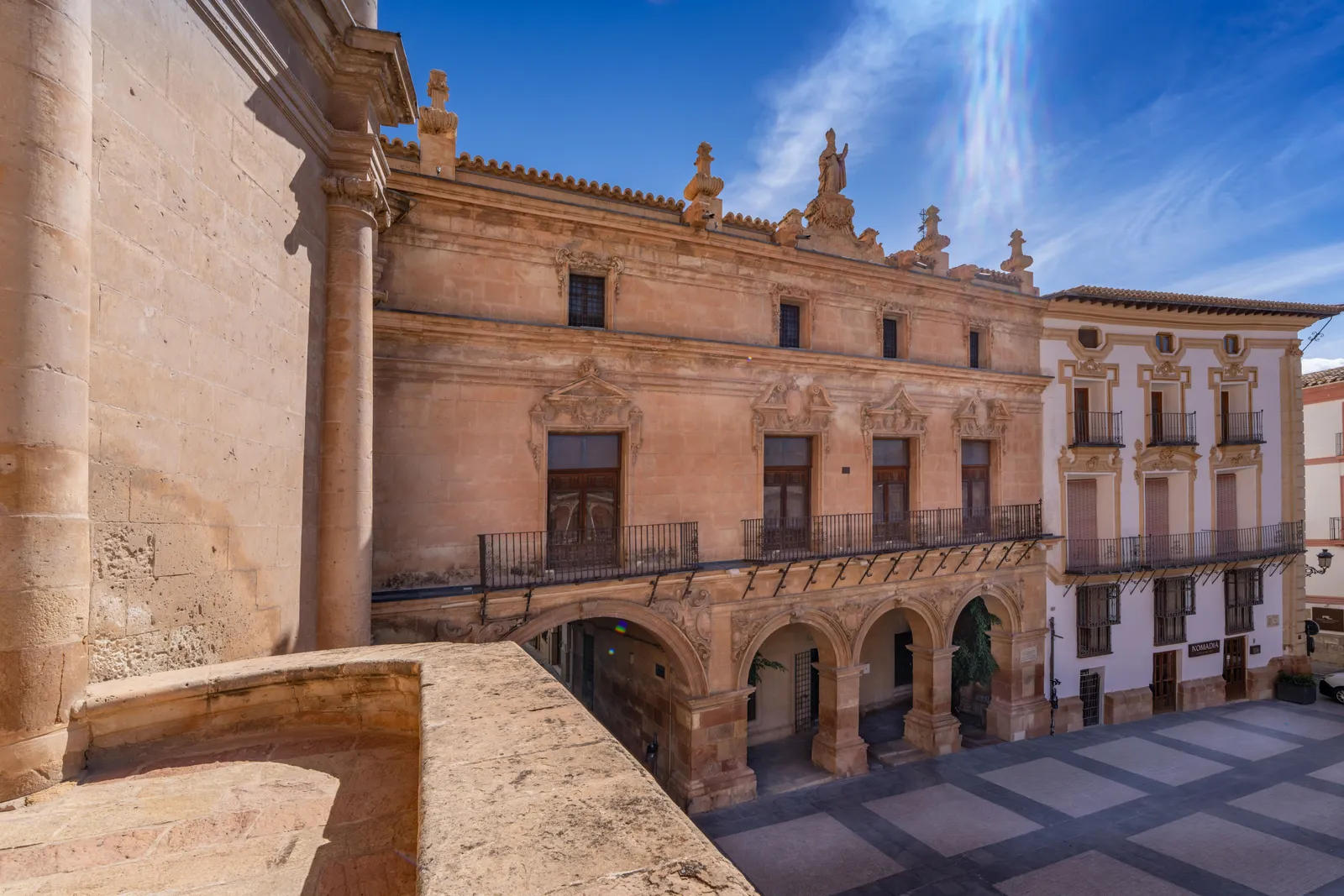 A historic arcaded square with stone columns and old facades in Spain
