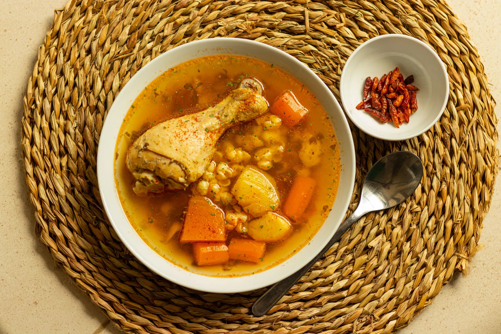 A bowl of cocido stew with chickpeas, carrot and meat in Madrid, Spain