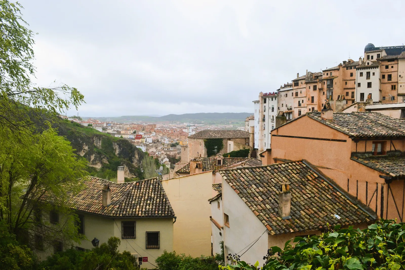 Stone houses of the old town of Cuenca perched above a wooded gorge, Spain