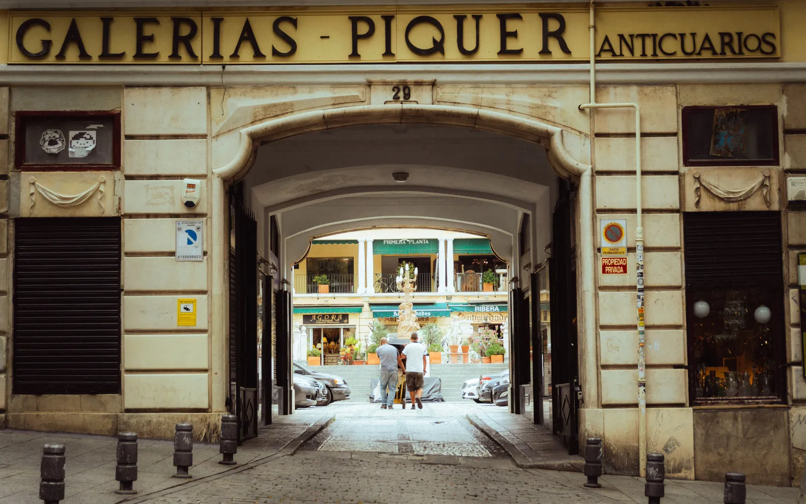 The entrance arch of the Galerias Piquer antiques arcade at El Rastro, Madrid, Spain