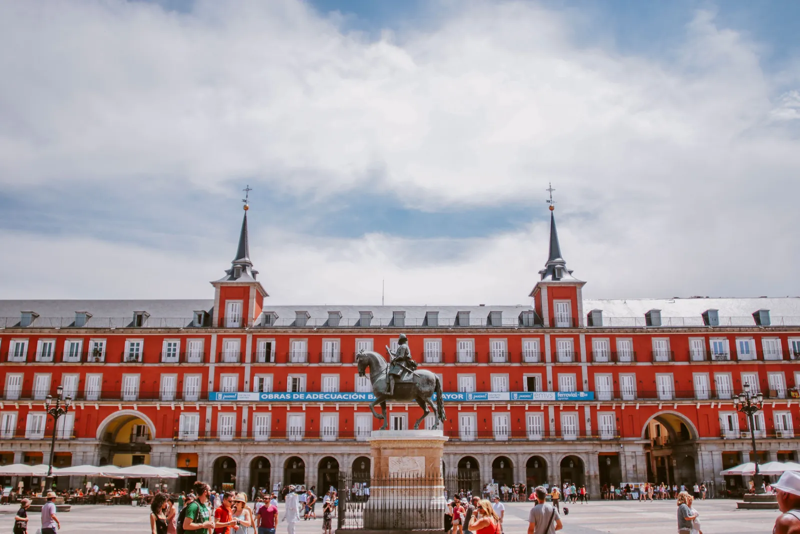 A sunny view across Madrid rooftops toward the domes of the old center on a clear day