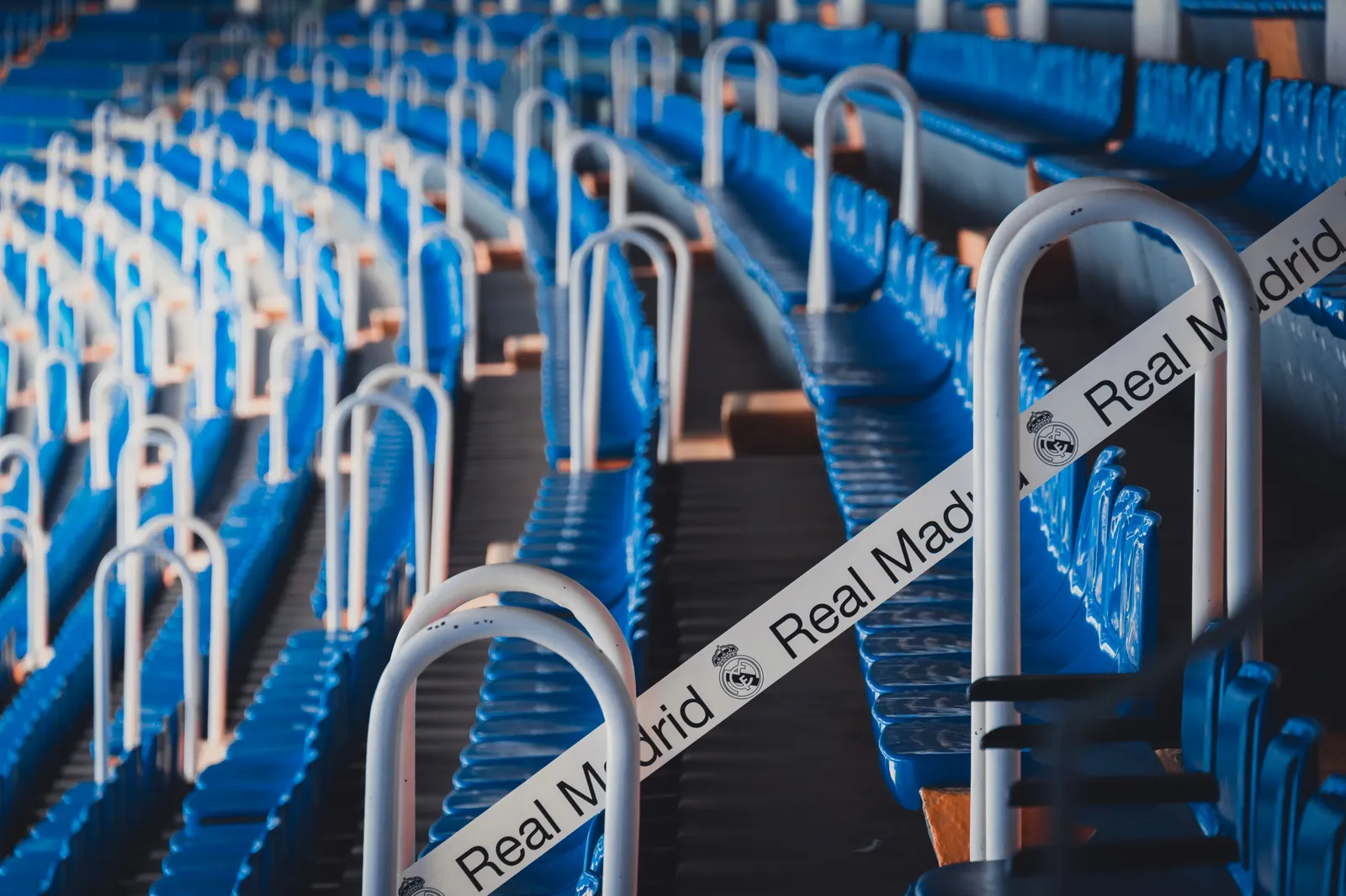 Rows of blue seats in a football stadium in Madrid, Spain