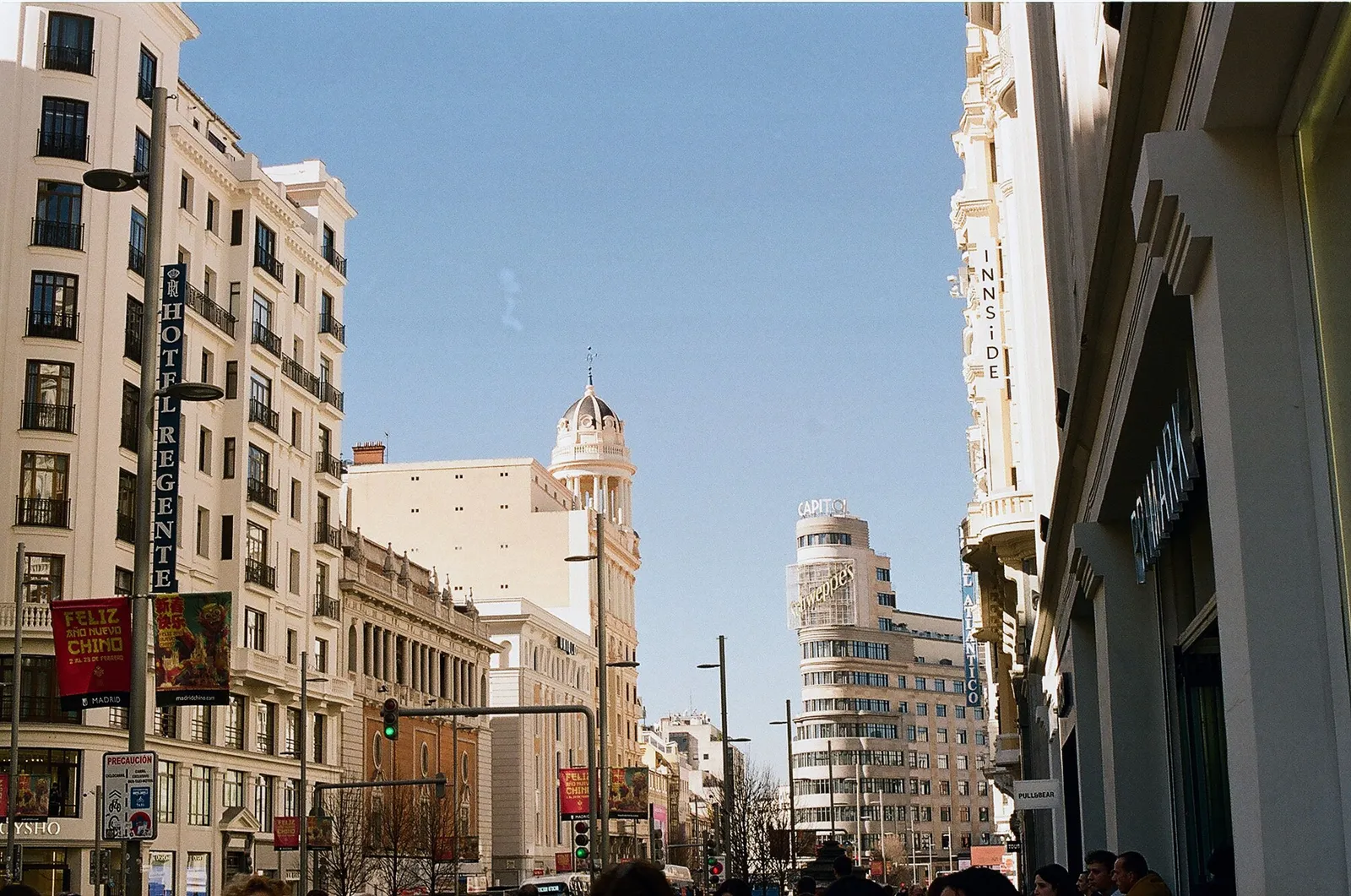 A street of tall balconied apartment buildings on Gran Via in central Madrid, Spain