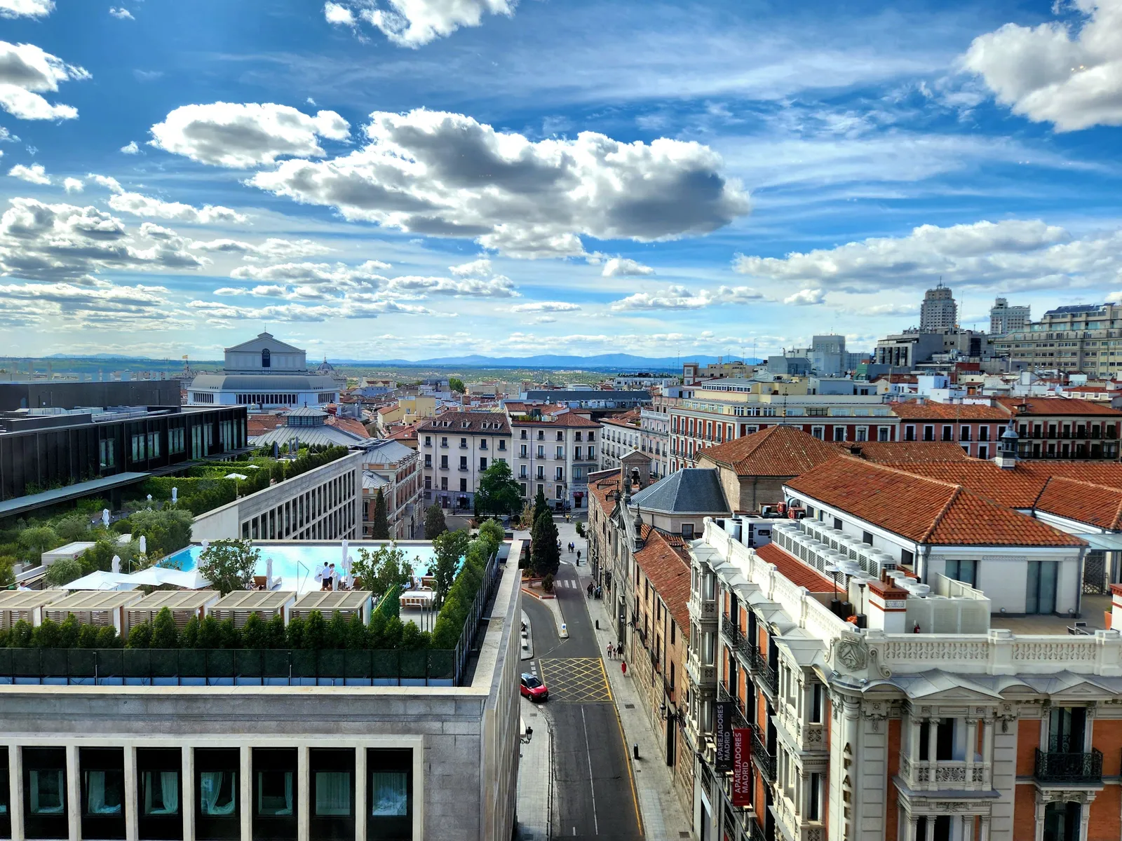 A rooftop view over the tiled roofs and skyline of central Madrid, Spain