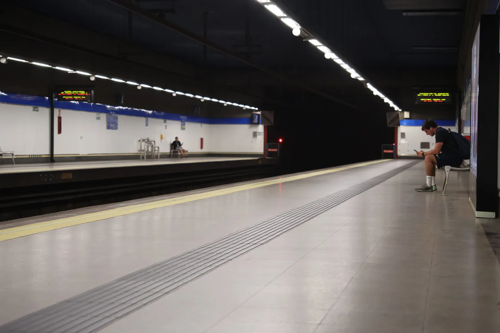 An empty underground metro station platform in Madrid, Spain