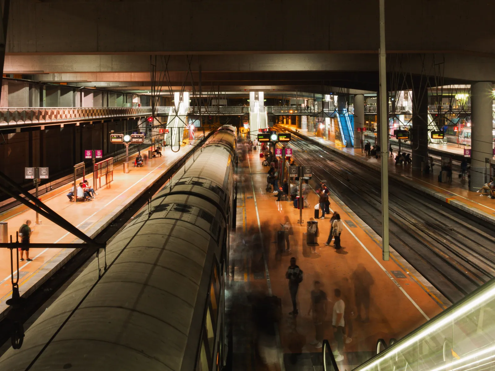 Passengers waiting on a busy metro platform in Madrid, Spain