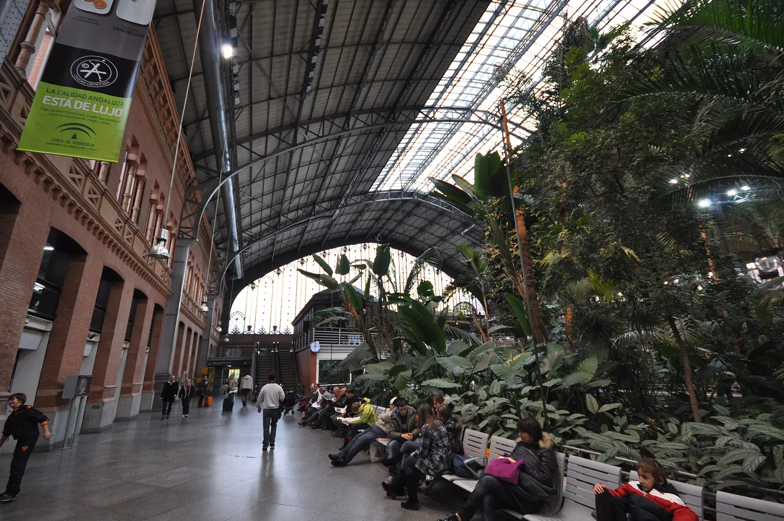 The airy interior concourse of Atocha station in Madrid, Spain, with its indoor garden