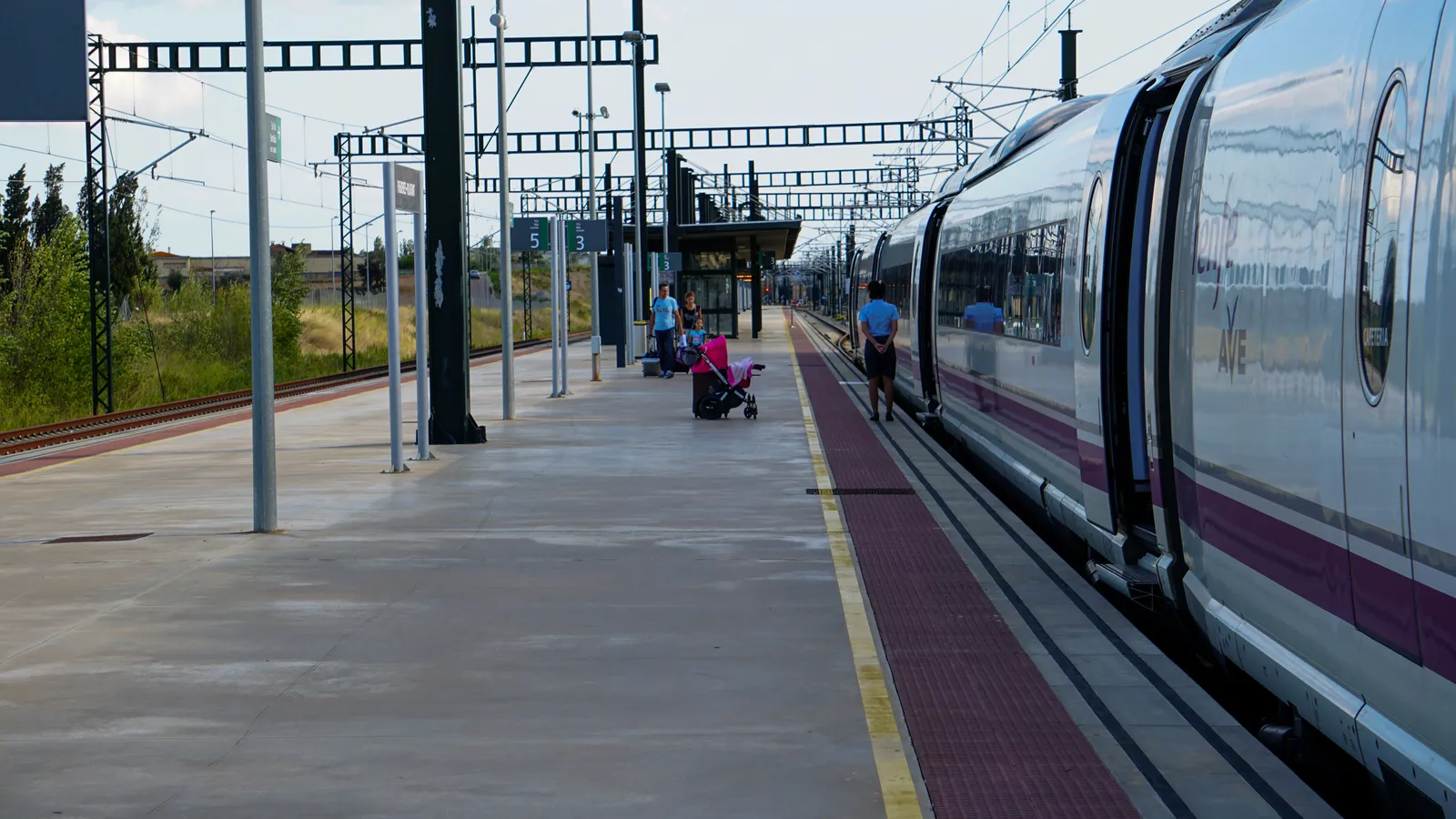 A high speed train waiting at a platform in Spain