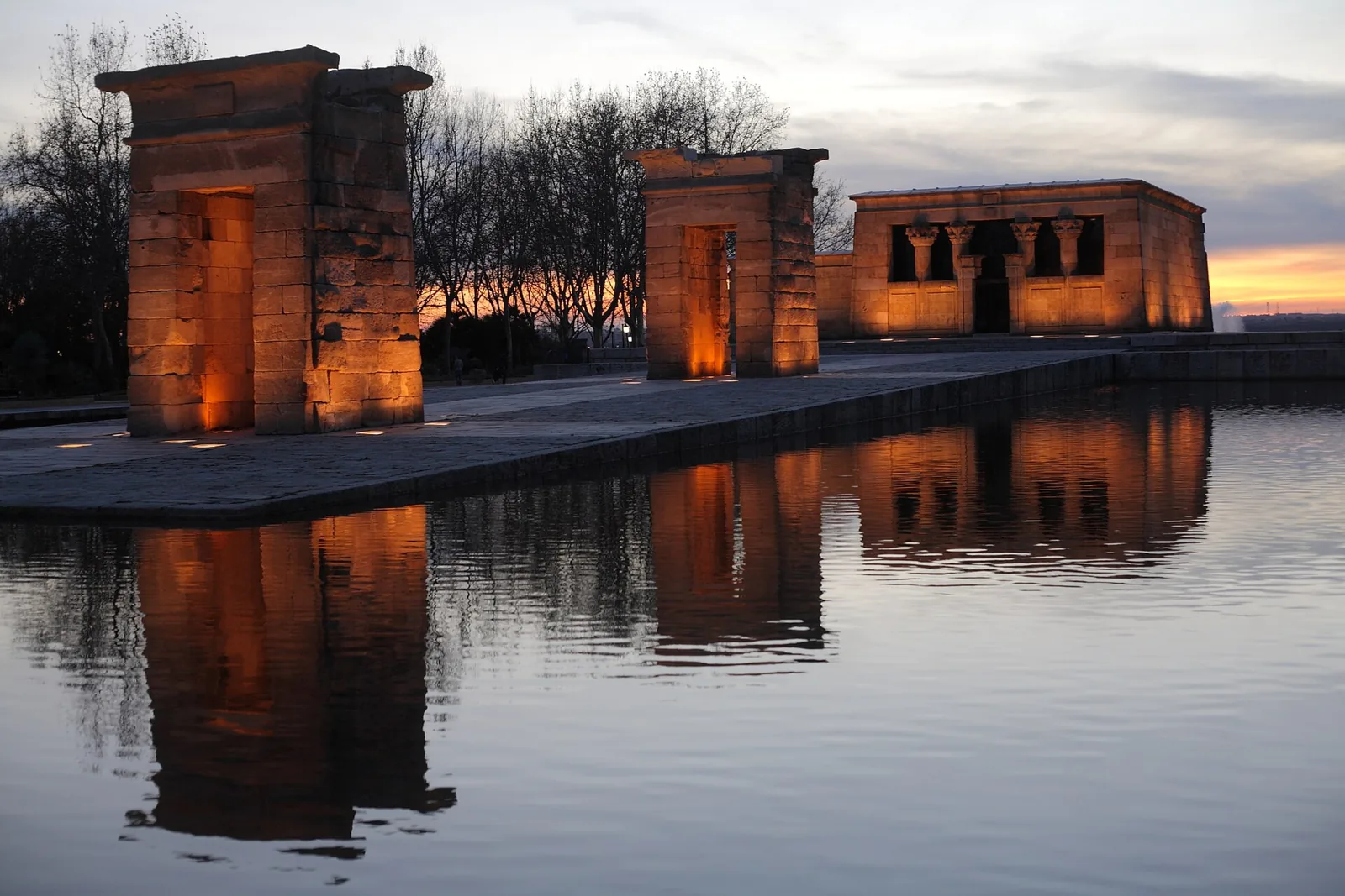 The Templo de Debod reflected in its pool at sunset in Madrid, Spain