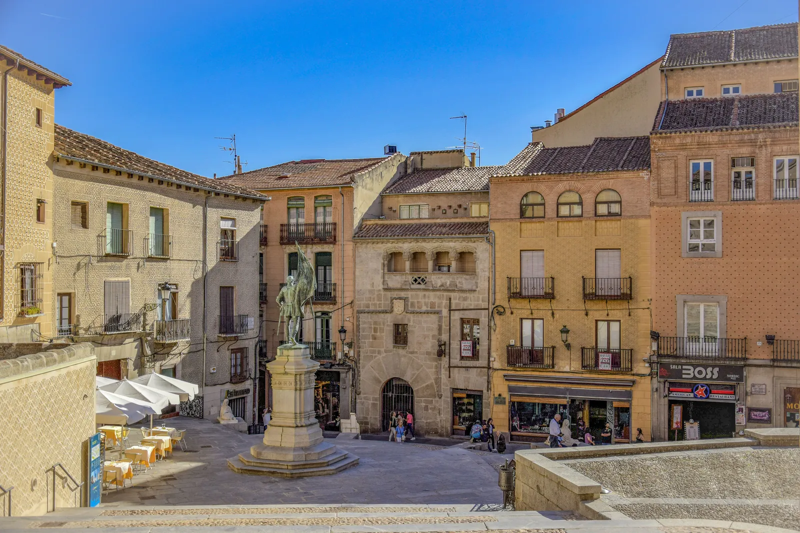 The plaza and stone houses of the old town of Segovia in Spain